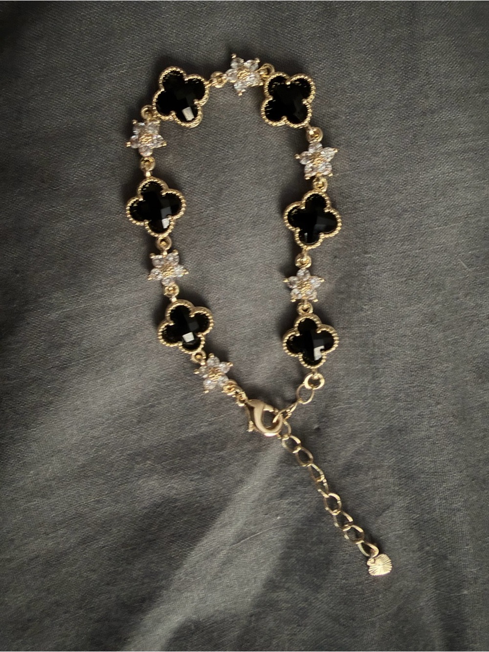 Gold Bracelet with Black Clover Accents and Clear Crystal Flowers